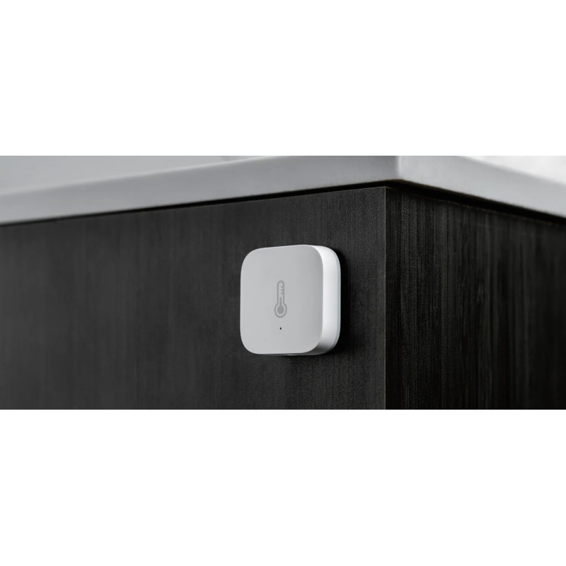 Czujnik temperatury i wilgotności Aqara T1 (TH-S02D) - biały, kwadratowy czujnik w domu.