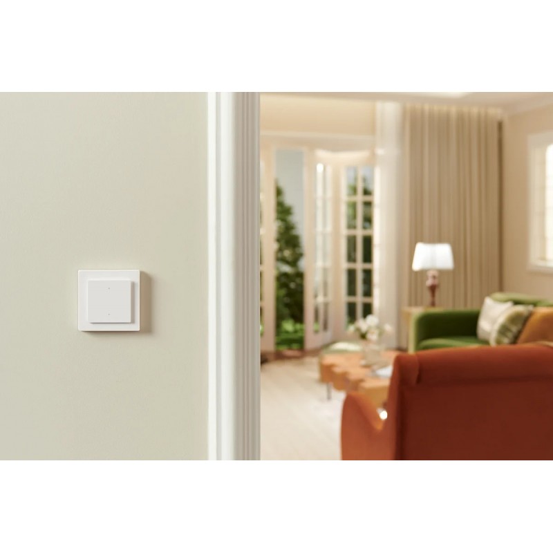 Aqara Light Switch H2 EU - inteligentny przełącznik oświetlenia Aqara Light Switch H2 EU – biały przełącznik ścienny do inteligentnego sterowania oświetleniem, montaż w nowoczesnym salonie.