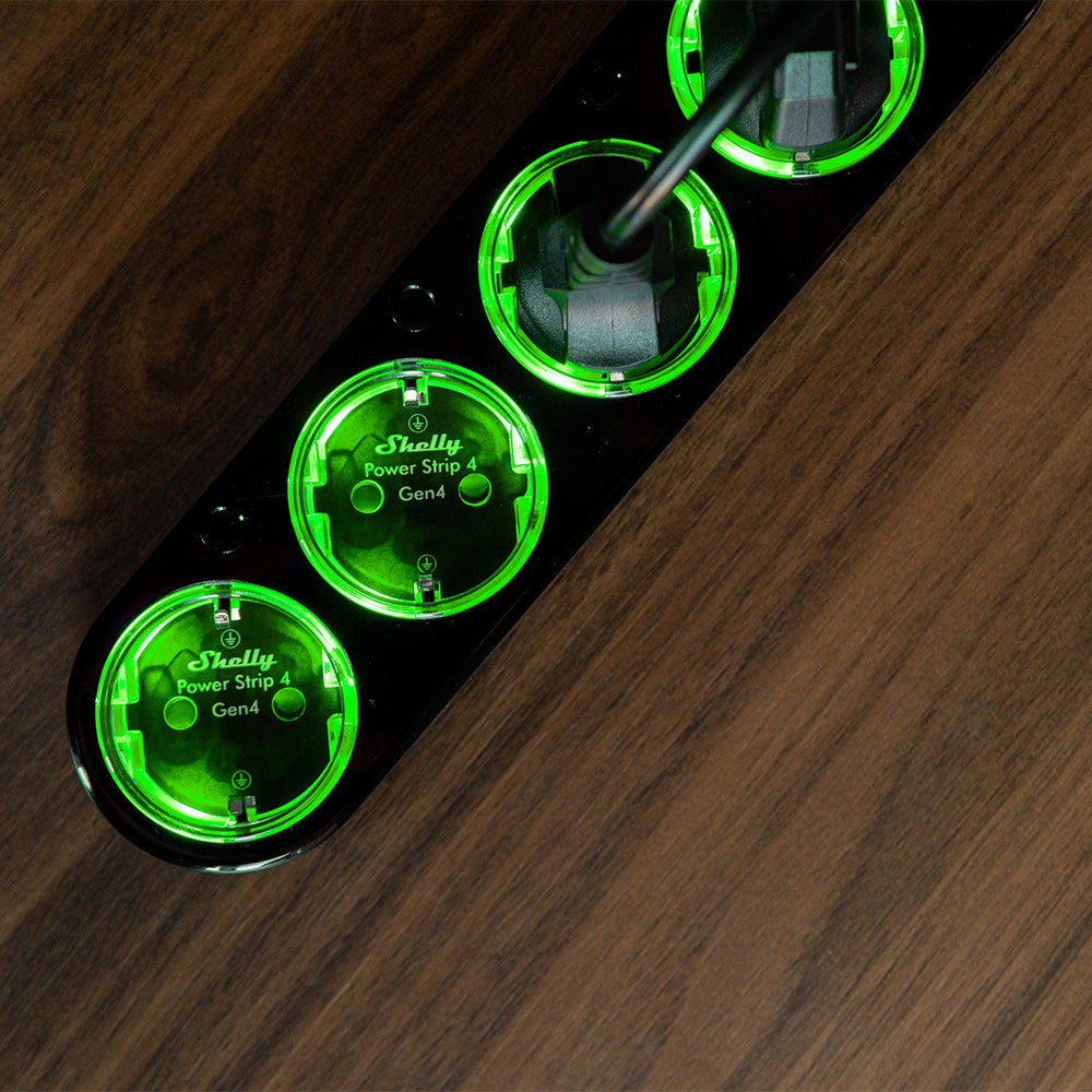 Shelly Power Strip 4 Gen4 czarny Shelly Power Strip 4 Gen4 - czarny przyciemniony zielonym światłem złącznik elektryczny